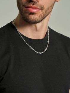 Step up your style game with our Men's Layered Curb Chain Necklace – a distinctive two-strand design featuring a bold curb chain paired with a unique specialty chain. Crafted from durable stainless steel, it offers a masculine and modern aesthetic that's versatile for any occasion. Modern Necklace With Solid Cuban Link Construction, Modern Metal Cuban Link Chain Necklace, Modern Silver Double Chain Necklace, Modern Metal Cuban Link Necklace With Curb Chain, Modern Everyday Cuban Link Necklace, Modern Stainless Steel Curb Chain Necklace, Modern Stainless Steel Cuban Link Chain Necklace, Modern Metal Jewelry With Figaro Chain, Modern Cuban Link Chain Necklace