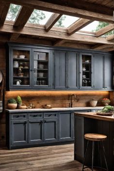 a kitchen with blue cabinets and wooden floors