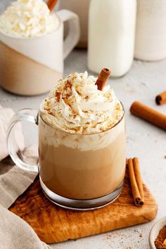 two mugs filled with hot chocolate and whipped cream