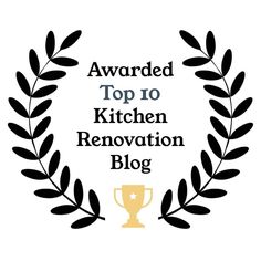 the top 20 kitchen renovation blog award is shown in black and gold with an olive wreath around it