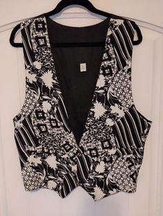 "This is a fabulous Vintage Mod 100% Rayon Abstract Design Vest Sz L. Made in the USA this beautiful jazzy vest features a 2 button closure. It has been gently worn and is in excellent condition. Measurement Length 23\" Chest 42\"" Retro V-neck Vest For Spring, Retro V-neck Fitted Vest, Vintage V-neck Vest For Spring, Retro Fitted Summer Vest, Retro V-neck Spring Vest, Retro Fitted Vest For Summer, Retro Sleeveless Spring Vest, Spring V-neck Retro Vest, Vintage Vest With Button Closure For Spring