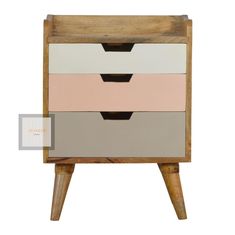 the three drawers are made from wood and have different colors on each side, including pink