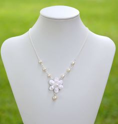 Featuring Gardenia Centered Necklace. MATERIAL AND MEASUREMENT: Gardenia size : approx 30mm. Flower glued on Filigree. The entire length of the necklace approximately 16.1/2 inches with 2 inches extender, finished with lobster clasp. I am happy to adjust the length per request. 6-8mm White Swarovski Pearls (pictured) . Glass Pearls Available. Silver Plated chain. Antique Brass , Gold plated available. Packed in a Gift box. SHIPPING TIME: The pictures are only for sample. Most Items are made to o White Flower Pendant Jewelry With Floral Decoration, White Flower Pendant Jewelry With Flower Decoration, White Flower Pendant Necklace For Wedding, Pearl White Flower Necklaces For Wedding, Pearl White Flower-shaped Jewelry With Flower Charm, Pearl White Flower Charm Jewelry, Pearl White Jewelry With Flower Charm, White Flower Bridal Necklace As Gift, Baking Polymer Clay