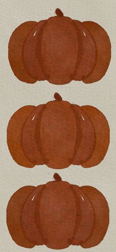 three orange pumpkins sitting on top of each other