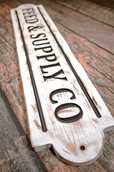 an old wooden sign that says city on it