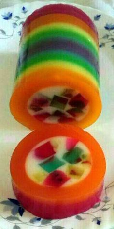 an image of soaps with different colors on them in the shape of rainbows