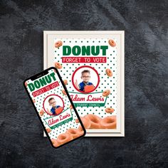 two cell phones sitting next to each other on top of a black surface with donuts