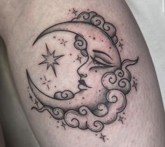 a woman's thigh with a crescent moon and stars tattoo design on the side