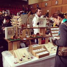 people looking at items on display in a room