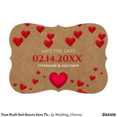 save the date card with red hearts on brown paper and hanging from strings, in front of a white background