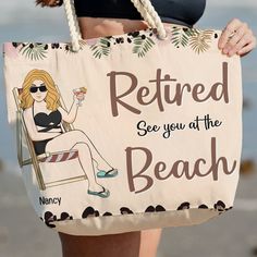 a woman holding a sign that says retired see you at the beach