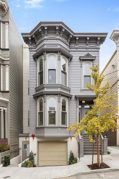 a two story house with an attached garage in the heart of san francisco, california