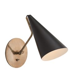 a black and gold wall light with a white shade on the back of it's head