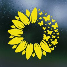 the sunflower is surrounded by butterflies in yellow on a green background with raindrops