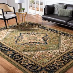 a living room filled with furniture and a rug