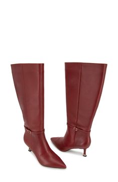 A buckled ankle strap adds modern sophistication to a knee-high leather boot balanced by a pointy toe and tapered heel. 2 1/2" heel 15" shaft; 15 1/4" calf circumference Side zip closure with elastic gore inset Cushioned footbed Leather upper/synthetic lining and sole Imported Fitted Knee-high Boots With Buckle For Work, Formal Knee-high Boots With Buckle And Pointed Toe, Red Pointed Toe Knee-high Boots For Formal Occasions, Knee High Leather Boots, Leather Boot, Kenneth Cole, Knee High Boots, Red Leather, Side Zip