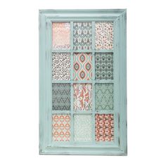 an old window with many different patterns on the outside and inside, painted in aqua blue