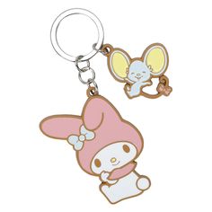 an animal shaped keychain with a cartoon character on the front and back of it