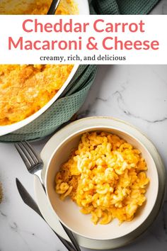 cheddar carrot macaroni and cheese in a white bowl on a marble table