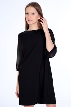 "Our 60s inspired simple elgance dress cut in A- line silhouette, above the knee length and sheer 3 4 sleeves.  The black glitter lace trim beautifully at the neckline. Handcrafted from fabric with excellent drape and durability.  Our model is 172 cm and wears EU size 36. To be sure, please choose one size up. Details & Composition: * 74% polyester, 26& viscose- fabric OEKO-tec certified 1000 * 3/ 4 sheer sleeves * Crew neck with glitter band * Hidden zip 20cm back Washing instructions: 30o fine wash, do not tumble Please check the actual size measurements before purchasing. Size 34 (XS) (US S 0-2, UK 4-6, Italian 36-38, French 32-34) Bust: fits bust around 31.5\"-80 cm Waist: fits waist around 26\"- 66 cm Hips: fits hips around 35,4\"- 90 cm Size 36 (S) (US S 2-4, UK 6-8, Italian 38-40, F Elegant Cocktail Evening Dress With 3/4 Sleeves, Chic Half-sleeve Midi Party Dress, Elegant Party Dresses With 3/4 Sleeves, Elegant Cocktail Dress With 3/4 Sleeves, Elegant Half Sleeve Party Dresses, Elegant Evening Dress With 3/4 Sleeves, Elegant 3/4 Sleeve Evening Dress, Elegant Black Dress With 3/4 Sleeves, Elegant Mini Dress With 3/4 Sleeves For Formal Occasions