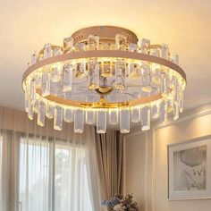 a chandelier hanging from the ceiling in a living room