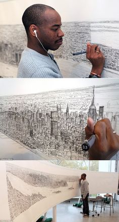 a man is drawing on the wall with his headphones