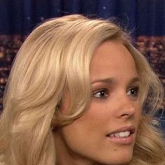 a close up of a person with long blonde hair on the set of an interview