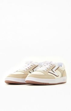 Step into a comfortable 80s-inspired style with the Vans Beige Lowland ComfyCush Leather Sneakers, featuring a distinctive "Flying V" logo. This archival Vans silhouette from the 80s boasts a slim profile and a modernized ComfyCush outsole for enhanced comfort. Originally created for tennis in the early 80s, this low-top design retains its classic appearance while introducing the iconic "Flying V" Vans logo for a touch of excitement.

PLEASE NOTE: This shoe is offered in men' Vans Lowland, Mens 80s, Flying V, Vans Logo, Skate Wear, Vans Shop, Vans Sneakers, Top Design, Fall Style