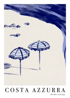 two beach umbrellas sitting on top of a sandy beach