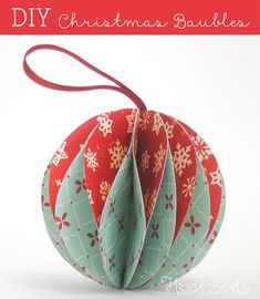 an ornament shaped like a hot air balloon with snowflakes on it