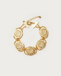 Golden Hojas Bracelet
| En Route Jewelry | En Route Jewelry Bohemian Gold Circle Jewelry, Vintage Gold Bracelets With Adjustable Chain, Vintage Gold Bracelet With Adjustable Chain, Adjustable Metal Bracelets With Intricate Design, Gold-tone Coin Shaped Metal Jewelry, Elegant Etched Metal Bracelets, Gold Engraved Metal Chain Bracelet, Gold Etched Bracelet Jewelry, Etched Brass Bracelet Jewelry