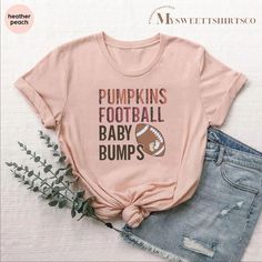 Fall Pregnancy Announcement Shirt, Pumpkins Football Baby Bumps Pregnancy Reveal Shirt, Fall Maternity Tshirt, Thanksgiving Maternity Tee --- How To Order ----- 1-) Please, check and review all the photos. 2-) Choose your t-shirt size and color. *Different styles of shirts may have different shades of same color choice due to different manufacturer brands. *For this reason, we recommend you to match shirts from the same styles if you want precisely matching colors (ex. Unisex, V-necks, Toddler, Fall Pregnancy, Fall Pregnancy Announcement, Pregnancy Reveal Shirt, Fall Maternity, Football Baby, Pregnancy Announcement Shirt, Maternity Tees, Pregnancy Tshirts, Pregnancy Reveal