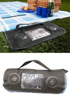 an outdoor picnic blanket with speakers on it