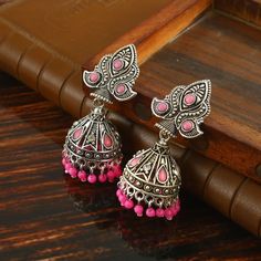 Overview These stylish Jhumki Earrings set from JewelryTrack will certainly leave you spellbound. These Jhumki Earrings set have an excellent finish and gives out an exquisite sense of style. If you are looking for an amazing Fashion Jewelry set for special occasions such as Anniversary, Engagement, Party, Wedding or for gifting , then your search ends here.  Item Description: The look is stunning and preciously suitable for all kinds of dressy occasions. Metal: Brass OCCASION: PARTY WEAR , WEDD Bollywood Jhumkas For Navratri With Pierced Ears, Pink Latkans Earrings For Navratri, Pink Drop Earrings Jhumkas For Festivals, Pink Dangle Jhumkas For Festivals, Pink Temple Jewelry Jhumkas For Diwali, Heavy Pink Jhumkas For Festivals, Oxidized Jhumkas, Desi Jewelry, Earrings Jhumka