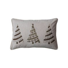 a white pillow with three christmas trees on it