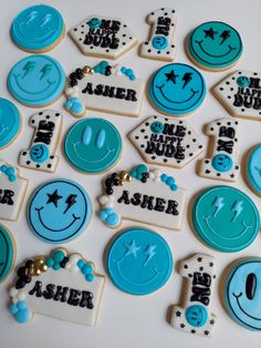 decorated cookies with blue and white frosting on a table