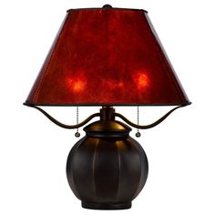 a table lamp with a red shade on it's side and a black base