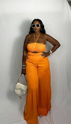 Who needs boring linen? Our Summer Orange Linen 2 pc set is the perfect standout color for your Summer outings. Set features high waist linen drawstring layered pants with pockets. Top has adjustable straps which can be tied at the neck or worn strapless. Elastic banding on the top and pants for an ultra comfortable fit. Set is tall girl friendly with an inseam of 36". S Available in S-L. Model is wearing a Large. Size US Size X Small 2-4 Small 6-8 Medium 10-12 Large 14-16 Xlarge 18-20 1X 22-24 Layered Pants, Summer Orange, Summer Kimono, Pants With Pockets, Tall Girl, Kaftan Dress, Pant Set, British Indian, Jumpsuit Dress