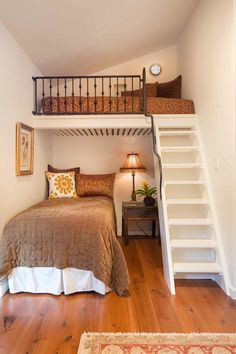 there is a loft bed with stairs to the top and bottom bunk in this bedroom