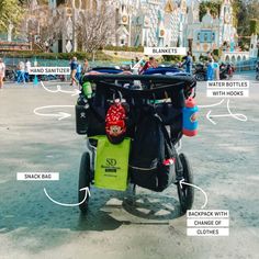 a child's bike with all the parts labeled on it in front of a theme park