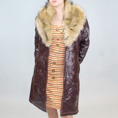 Vintage 90s Leather and faux fur coat! by Maxima from Wilson's. Burgundy/oxblood leather mid length coat with fluffy faux fur trim around the collar. Button and belt closure! Size LBust: 41"Waist: 34"Hips: 42"Length: 36 3/4" Retro Fall Fur Coat With Faux Fur Lining, Retro Fitted Fur Coat With Faux Fur Trim, Retro Fur Coat With Faux Fur Lining For Fall, Retro Faux Fur Lined Coat For Fall, Retro Outerwear With Faux Fur Lining, Retro Brown Faux Fur Coat, Oxblood Leather, Faux Fur Coat, Fur Trim