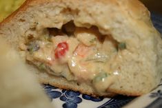 a close up of a piece of bread on a plate with food in the background