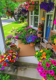 colorful flowers line the front porch of a house