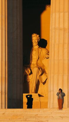 a person standing in front of the lincoln memorial