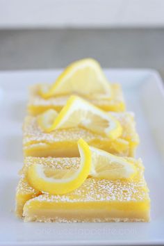 three slices of lemon cake on a white plate