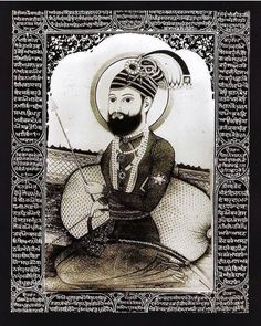 an image of a man with a beard and turban sitting on a couch