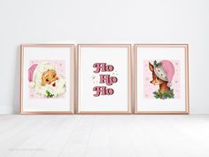 three framed pictures with santa claus and reindeers on them, hanging in a white room