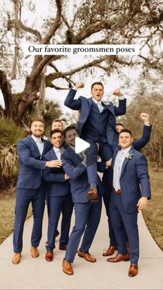 a group of men standing next to each other in front of a tree with the caption our favorite groomsmen poses