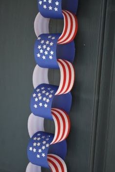 three american flags are hanging on the wall