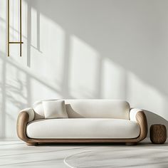 a white couch sitting in the middle of a room